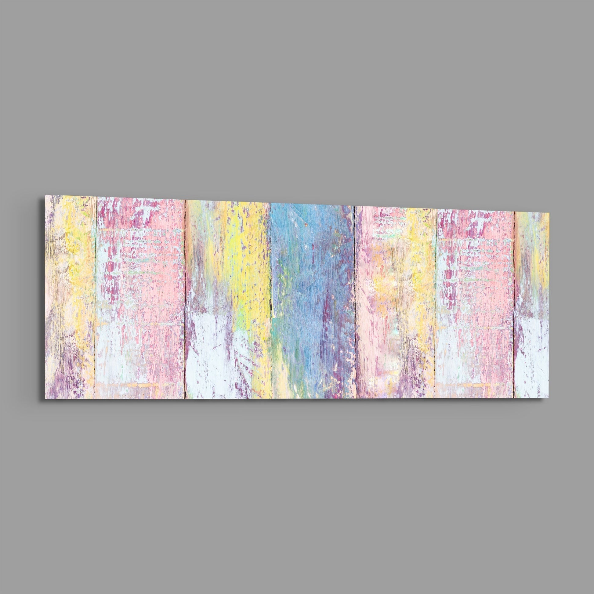 Horizontal rectangular glass wall art displaying painted vertical wood planks in pastel pink, yellow, blue, and white with distressed texture.