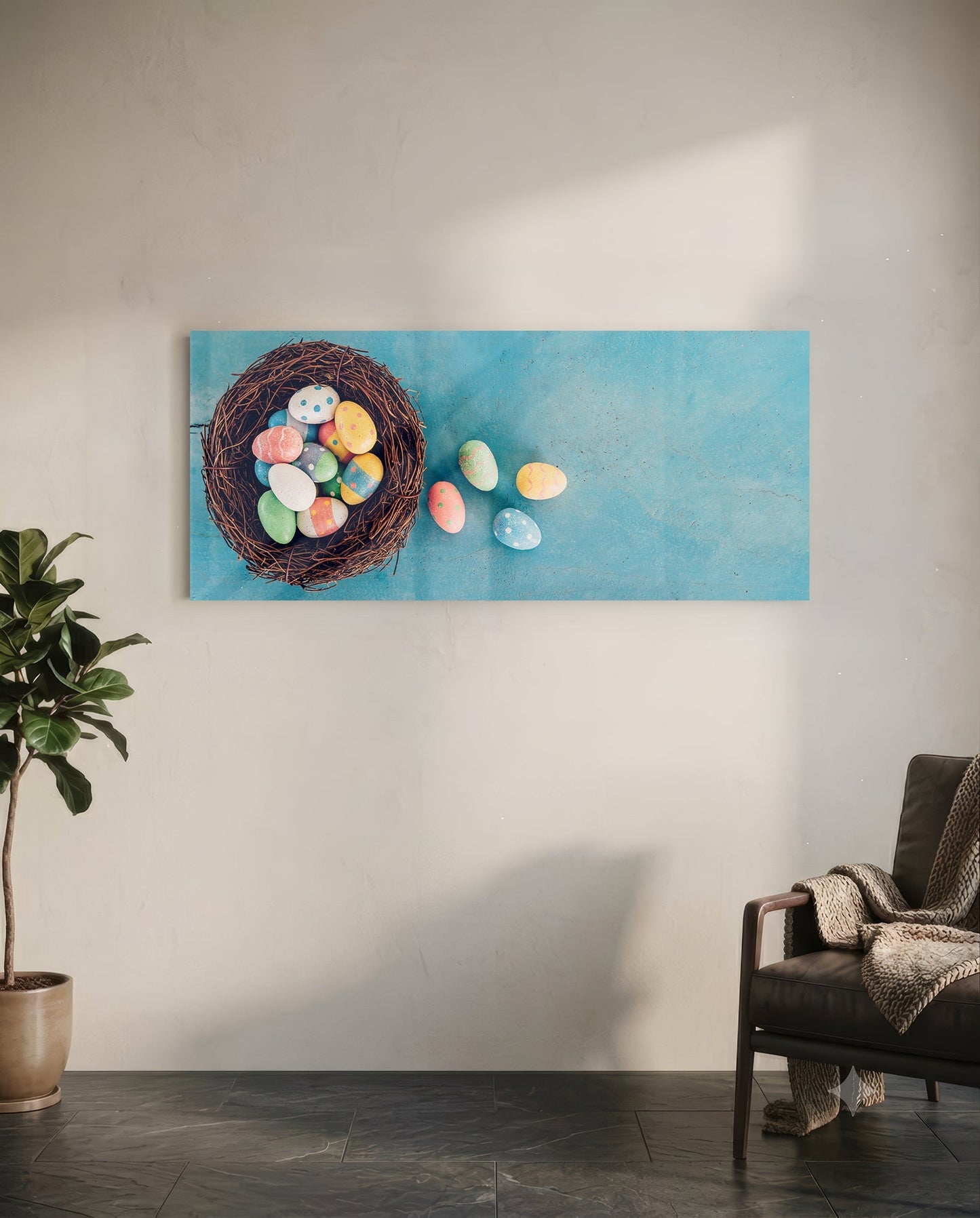 Glass wall art depicting colorful painted eggs spilling from a woven nest on turquoise background, displayed in modern living room.