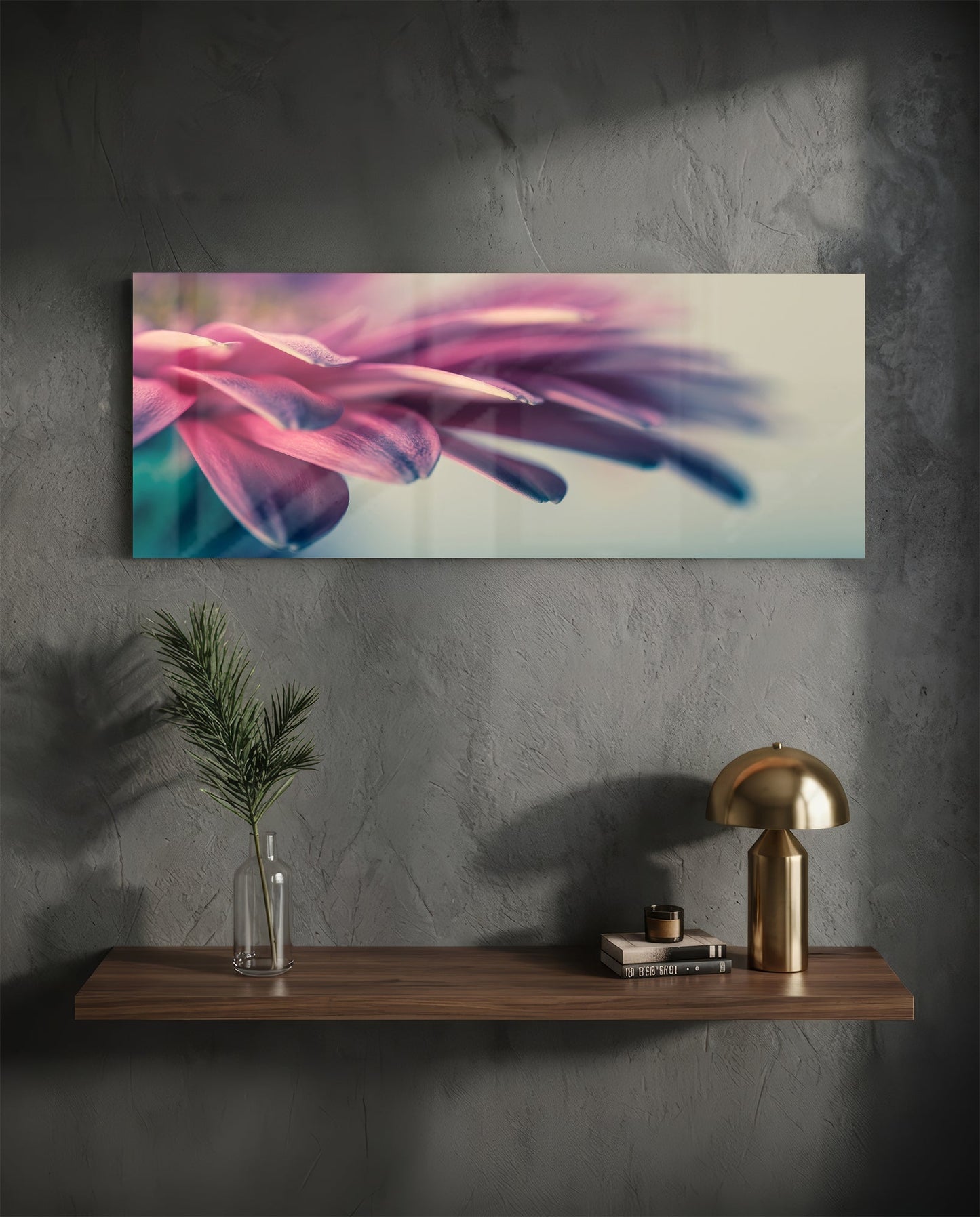 Macro glass wall art displaying close-up pink and purple flower petals with soft focus, mounted above wooden shelf with brass lamp and plant.