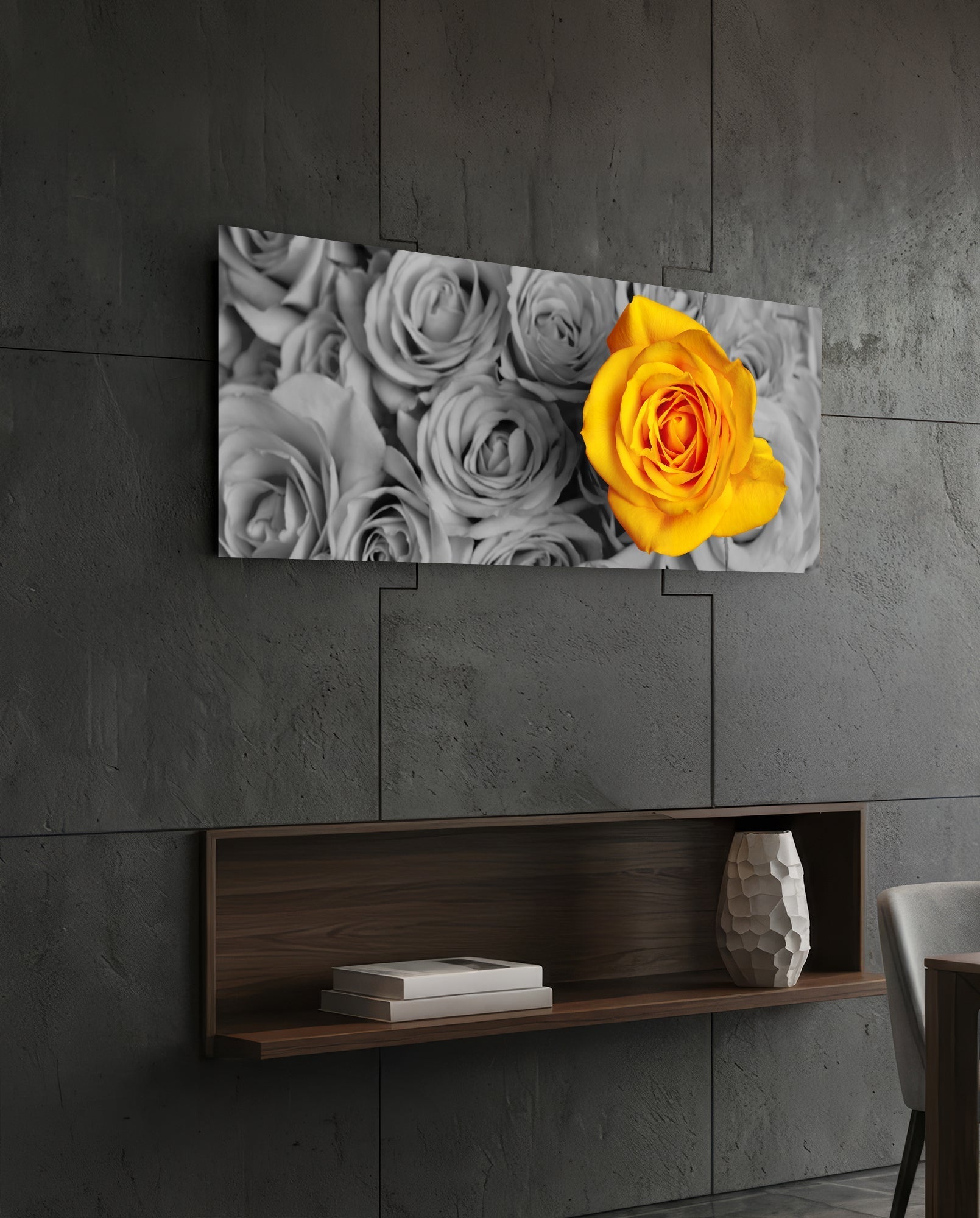 Yellow rose glass wall art hung above wooden shelf on concrete wall, displaying black and white roses with one vibrant yellow rose.