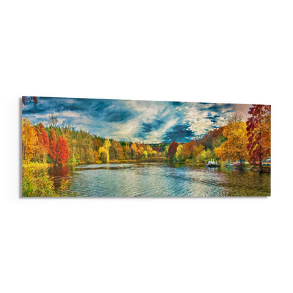 Panoramic glass wall art depicting an autumn lakeside landscape with colorful fall foliage, calm water, boats, and blue cloudy sky.