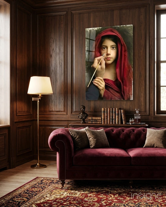 Portrait glass wall art depicting a young woman in red headscarf holding a paintbrush, displayed above burgundy sofa in wood-paneled room.