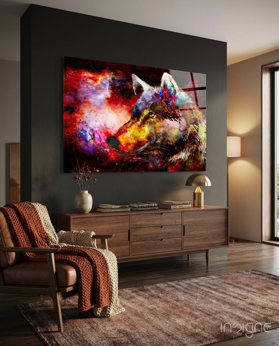 Colorful wolf glass wall art displayed above a wooden dresser in a modern living room with warm lighting.
