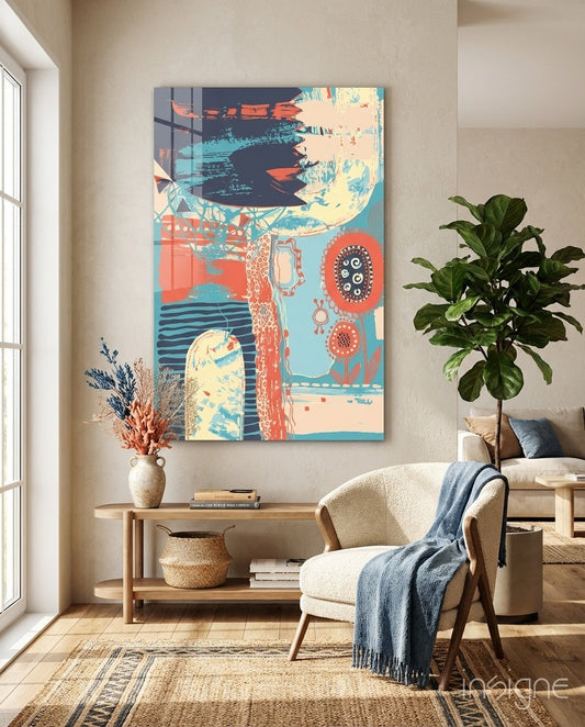Folk Bloom Collage Glass Wall Art displayed above wooden console table in modern living room with cream chair and potted plant.