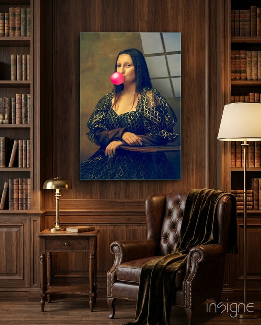 Glass wall art depicting Renaissance portrait with figure blowing pink bubble gum, displayed in traditional library setting above leather chair.