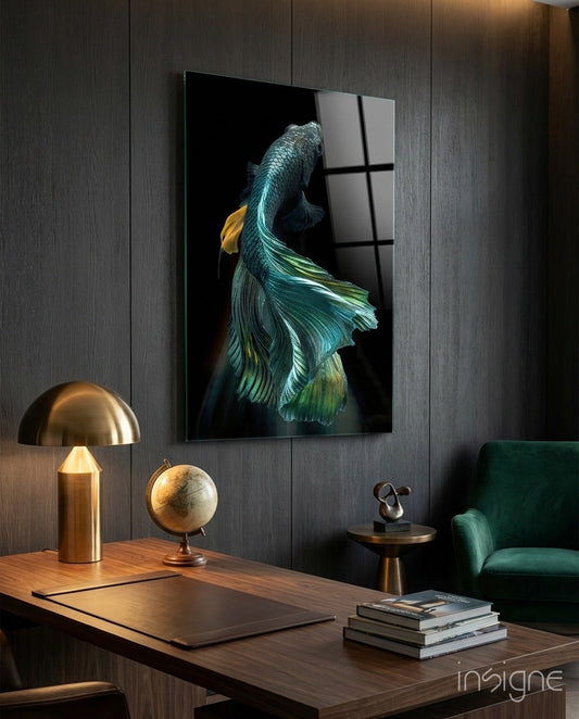 Teal and gold betta fish artwork displayed on dark wood-paneled wall above wooden desk in modern office setting.
