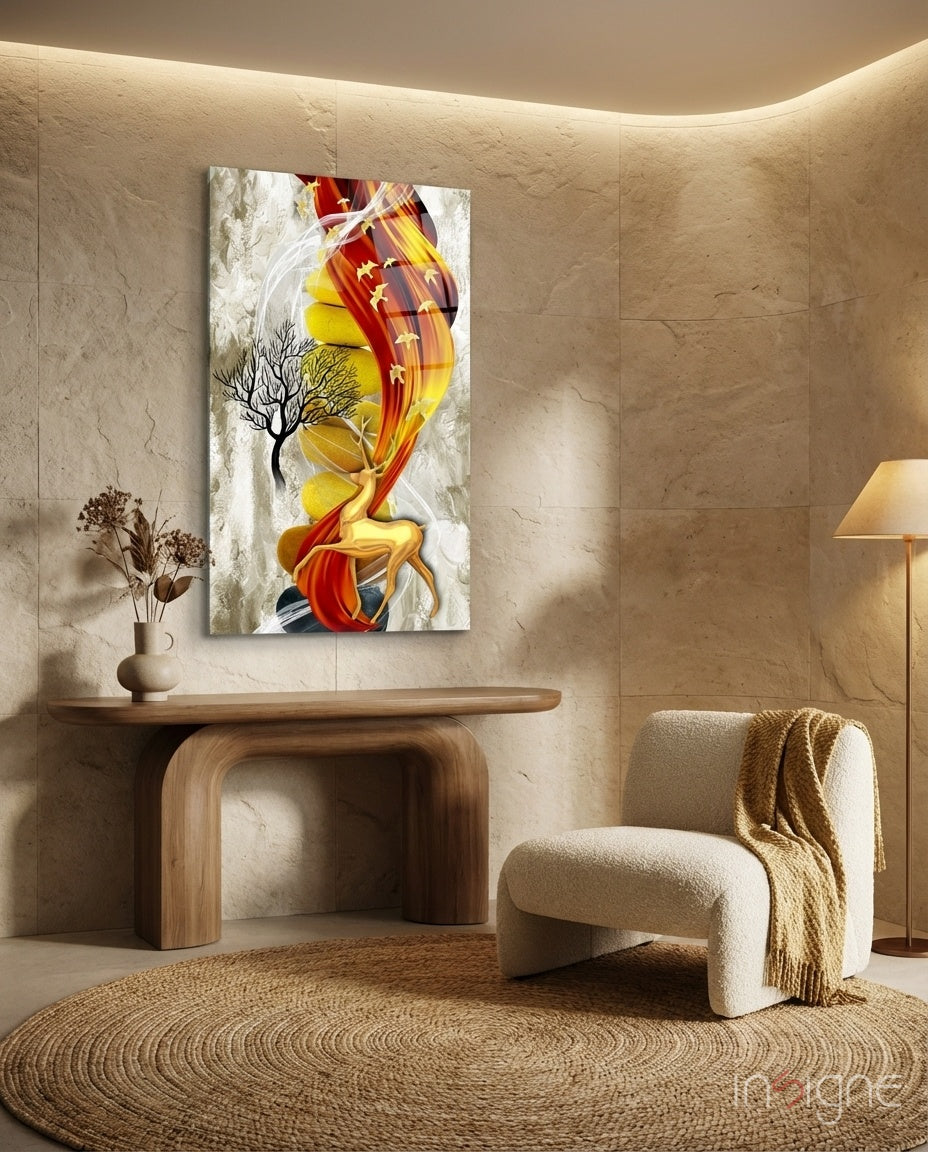Abstract Deer Glass Wall Art displaying red and yellow flowing forms with bare tree branches, hung in minimalist beige interior with wooden console table.