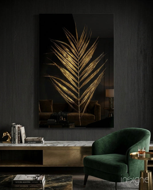 Golden palm leaf wall art with gold leaf design on black glass displayed above a marble console table in a modern living room setting.