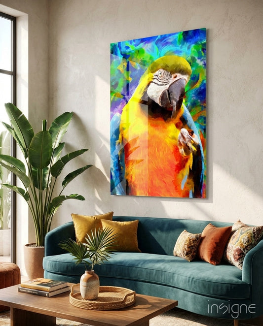 Vibrant glass wall art depicting a yellow and orange macaw against a colorful blue and green background, displayed above a teal sofa in a living room.