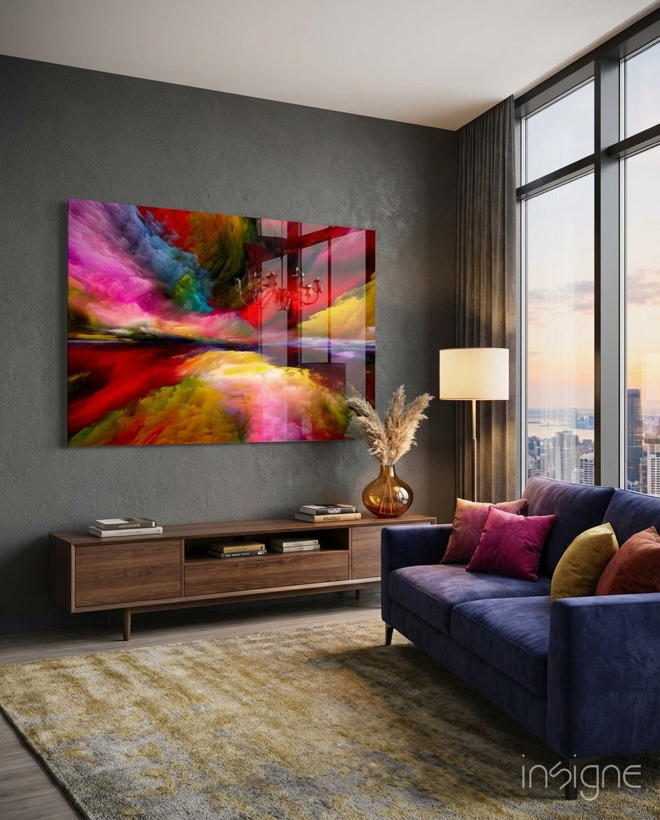 Colorful abstract glass wall art with vibrant pink, blue, yellow, and red swirls displayed above wooden media console in modern living room.