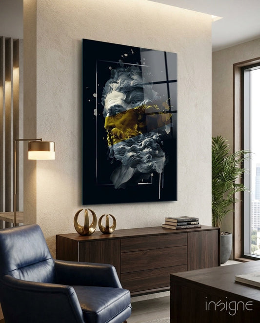 Modern office interior featuring black glass wall art with classical bust sculpture and gold paint stripe, mounted above wooden credenza.