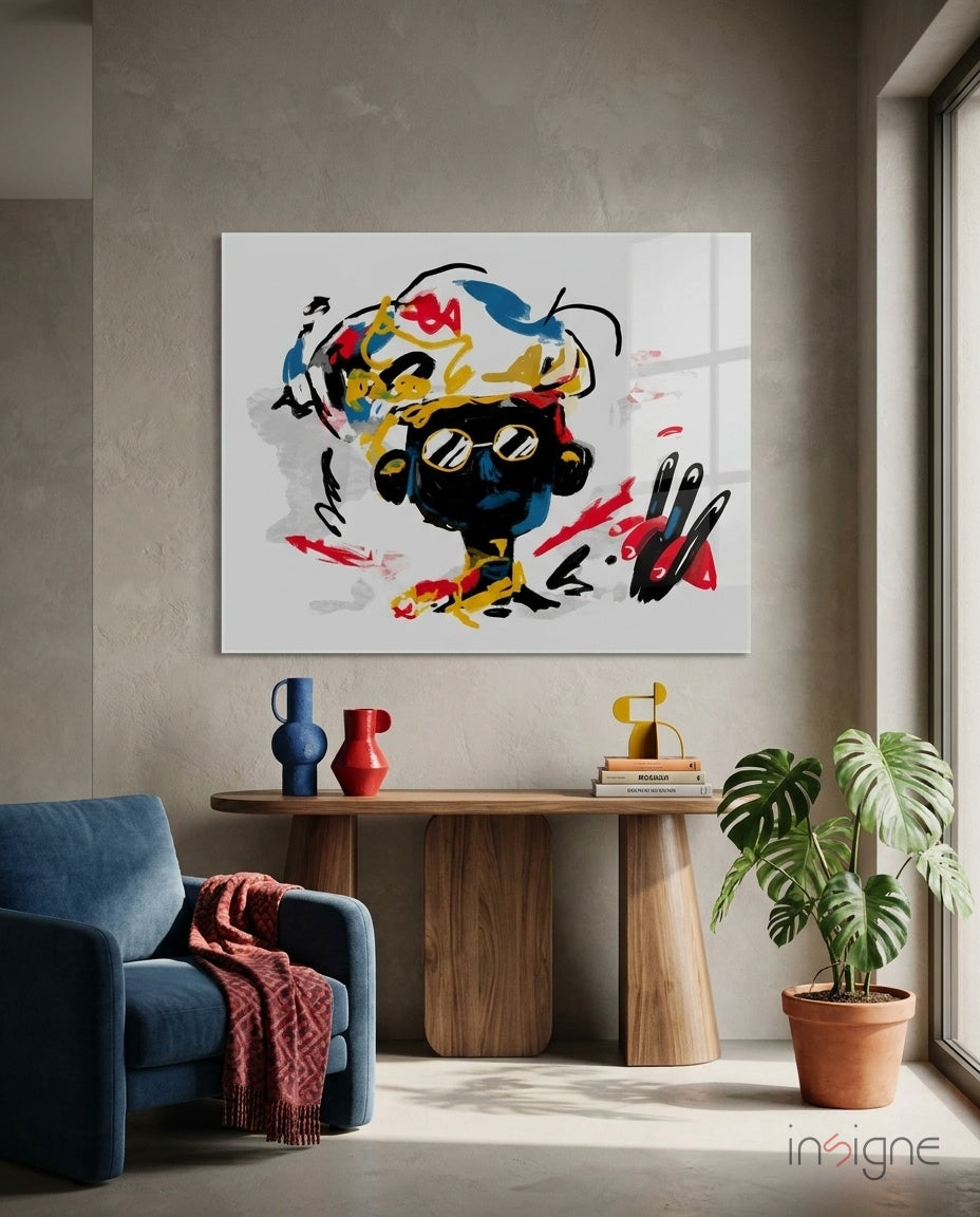 Colorful abstract glass wall art with black, yellow, red, and blue brushstrokes displayed above wooden console table in modern interior.