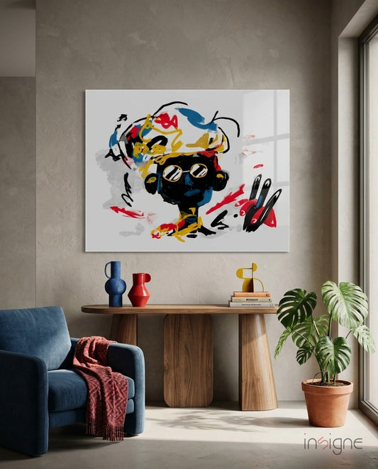 Colorful abstract glass wall art with black, yellow, red, and blue brushstrokes displayed above wooden console table in modern interior.