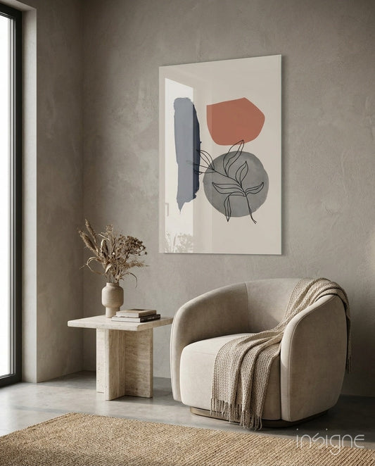 Modern minimalist room setting with beige chair, wooden side table, and abstract wall art featuring navy brushstroke, grey circle, and terracotta shape with line-drawn botanical elements.