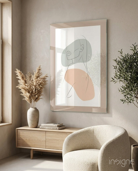 Sage Peach Line Portrait Glass Wall Art hung above wooden dresser in minimalist beige interior with potted pampas grass and cream armchair visible.