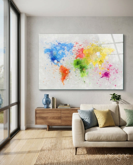 Watercolor world map glass wall art in blue, red, yellow, and green displayed above wooden dresser in modern living room.