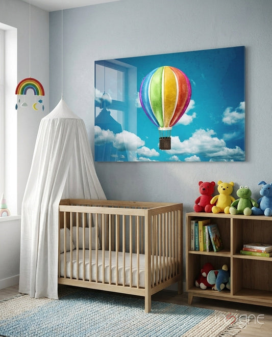 Colorful hot air balloon glass wall art displayed above wooden crib in nursery room with toys and storage.