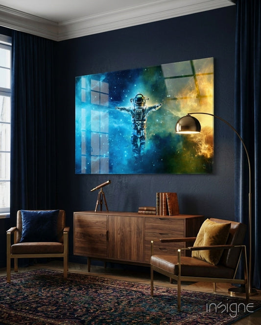 Arms Wide Nebula Astronaut Glass Wall Art displayed above wooden cabinet in modern office, showing astronaut with arms outstretched against blue and gold cosmic background.