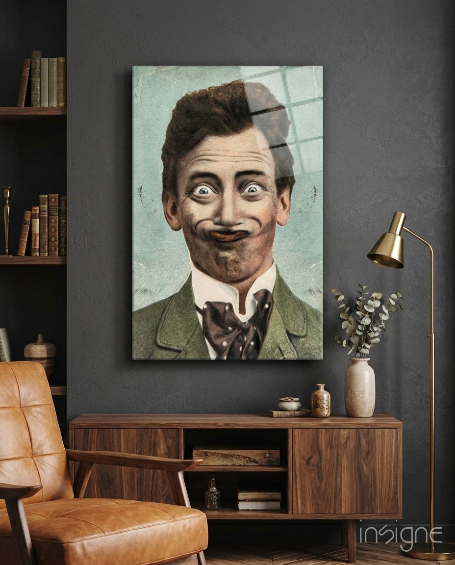 Vintage portrait of a man with exaggerated facial features in green jacket displayed on gray wall above wooden cabinet.