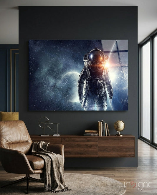 Modern living room interior with Cosmic Sun Flare Astronaut glass wall art mounted above wooden console table beside leather chair.