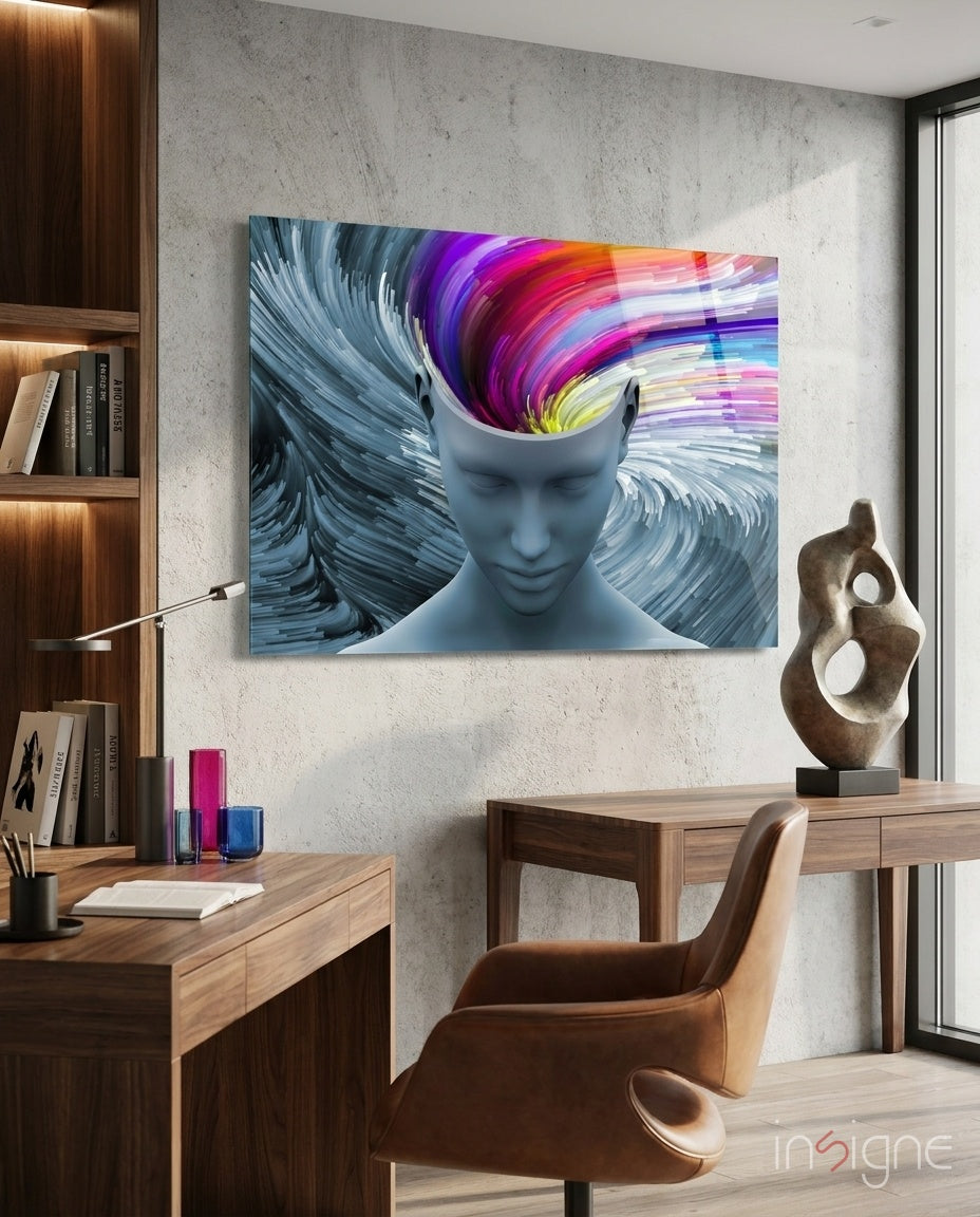 Vibrant glass wall art depicting a blue head with colorful swirling brain design displayed in modern office workspace.