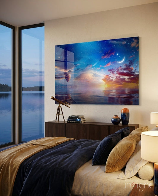 Hot air balloon and crescent moon canvas print displayed above bedroom dresser with water and sunset scene in blues, oranges, and purples.