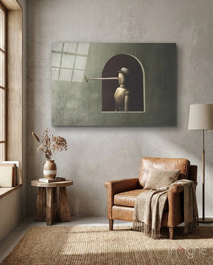 Pinocchio Glass Wall Art displayed above a cognac leather armchair in a minimalist room with wooden side table and natural lighting.