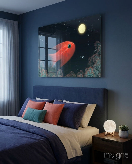 Glass wall art above navy bed showing red fish and moon over coral reef, displayed in dark blue bedroom with colorful pillows.