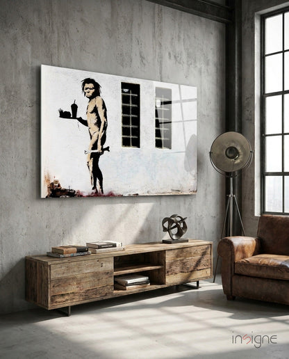 Neanderthal Glass Art canvas hanging on concrete wall above wooden media console in industrial loft interior with leather chair.