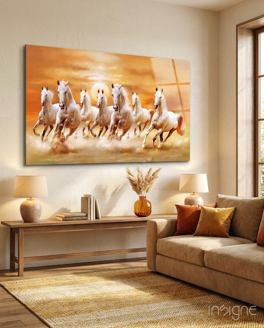 Running Horses Glass Art displayed above a wooden console table in a warm, neutral living room with beige sofa and amber accents.