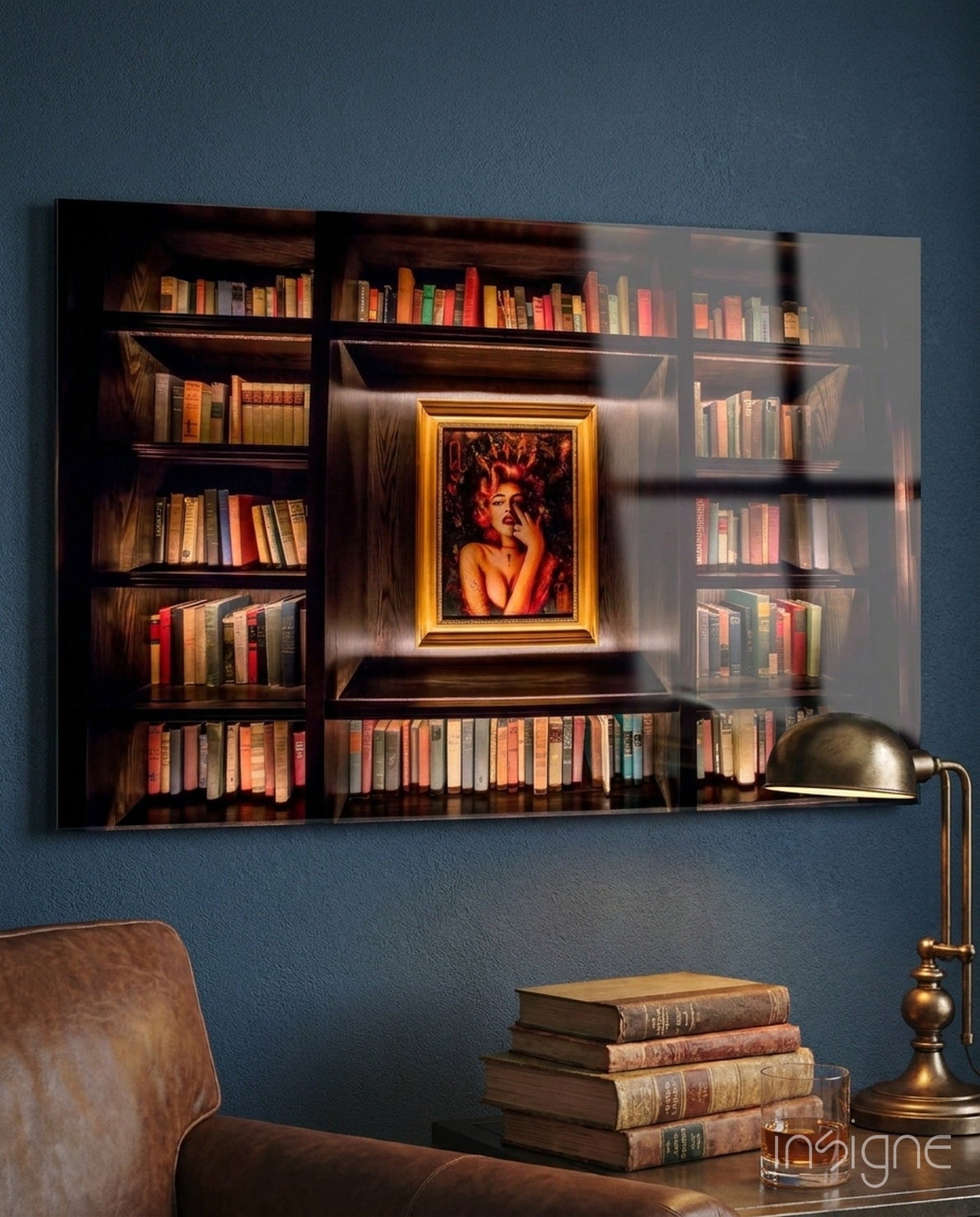Glass art print of wooden bookshelf with gold-framed portrait, displayed on blue wall above leather chair and brass lamp.