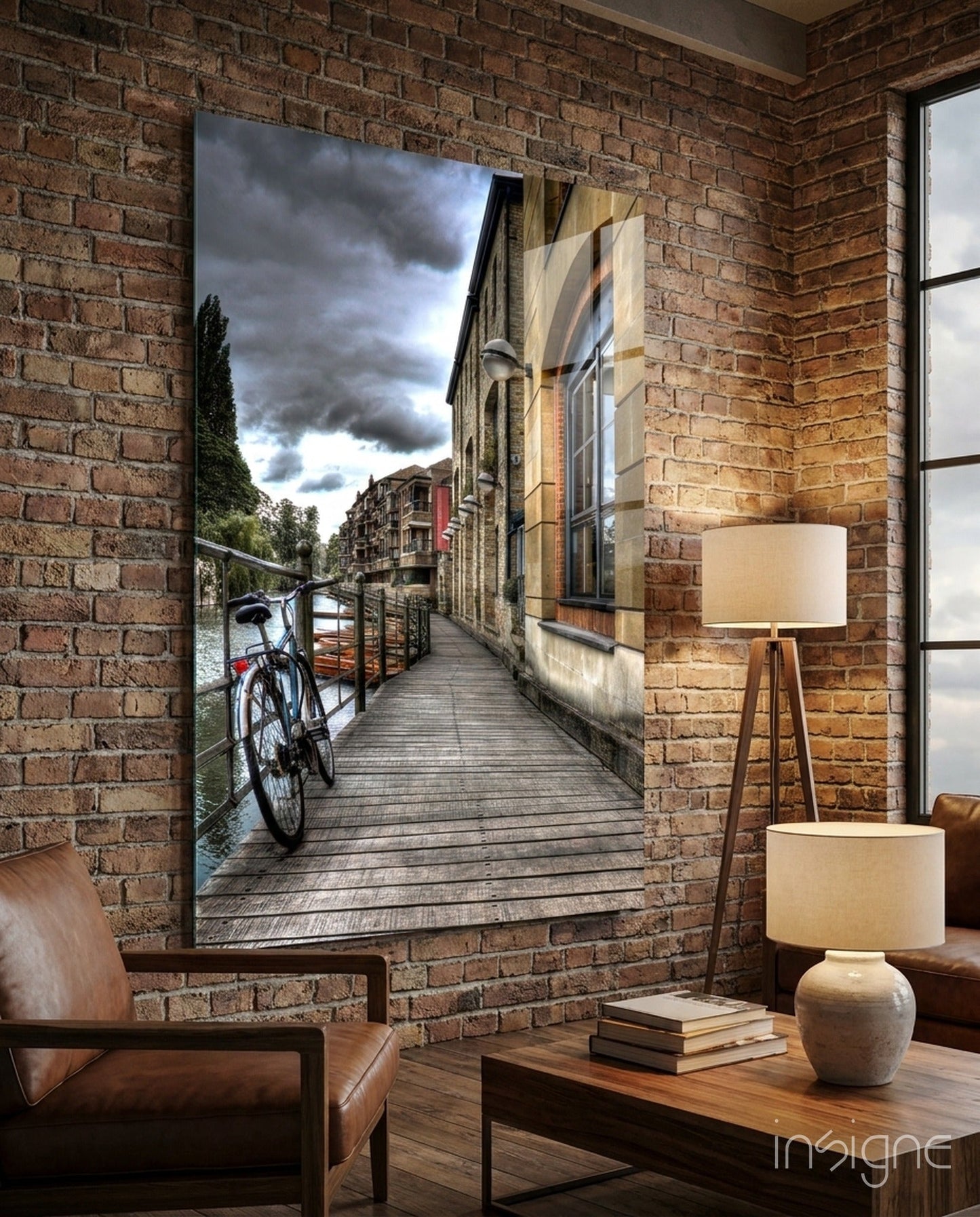 Glass wall art depicting a wooden boardwalk along a canal with a red bicycle and historic buildings under stormy sky.