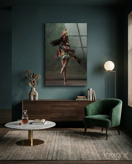 Ballerina in colorful floral dress canvas displayed on teal wall above wooden dresser in modern living room setting.