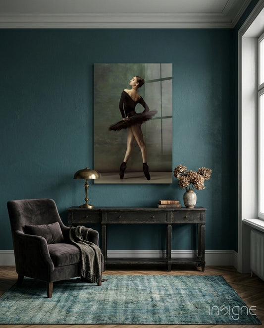 Ballerina glass wall art displayed above a dark desk in a teal-walled room with chair and accessories.