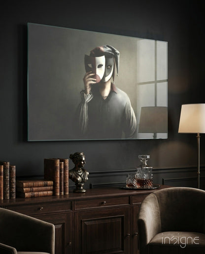 Masks Glass Wall Art displayed above a wooden desk in a dark study room with books, bust sculpture, and lamp.