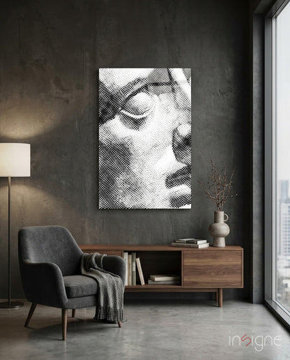 Black and white wavy line abstract canvas hanging above wooden credenza in minimalist concrete interior space.