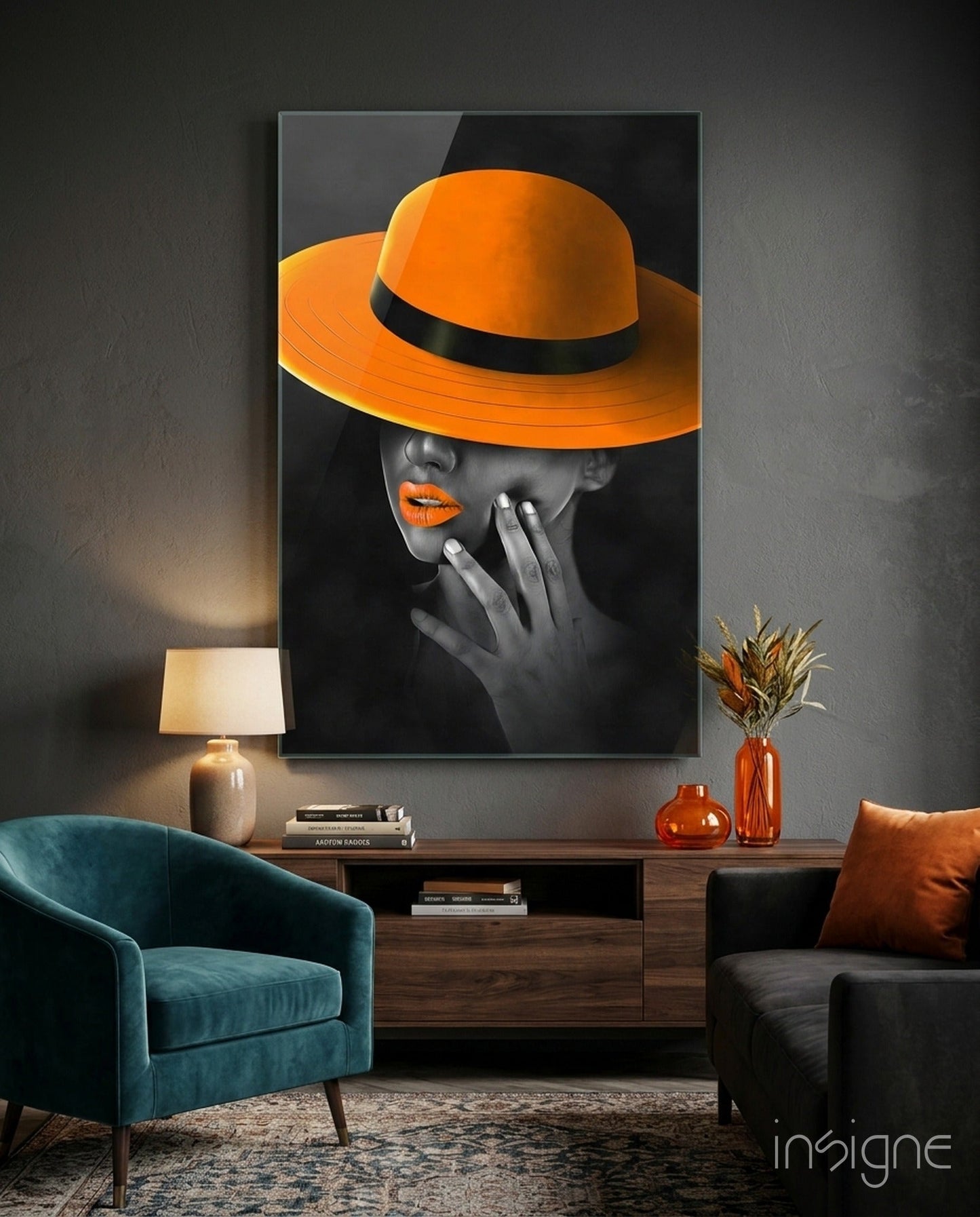 Orange Hat Glass Wall Art displayed above wooden console table in modern living room with teal chair and orange accessories.