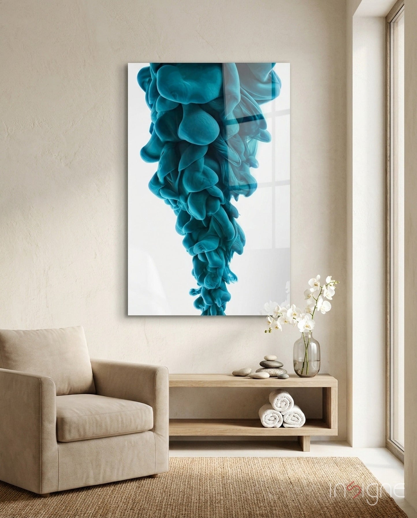 Blue layered glass wall art depicting cascading turquoise ink clouds displayed above wooden shelf in minimalist room setting.