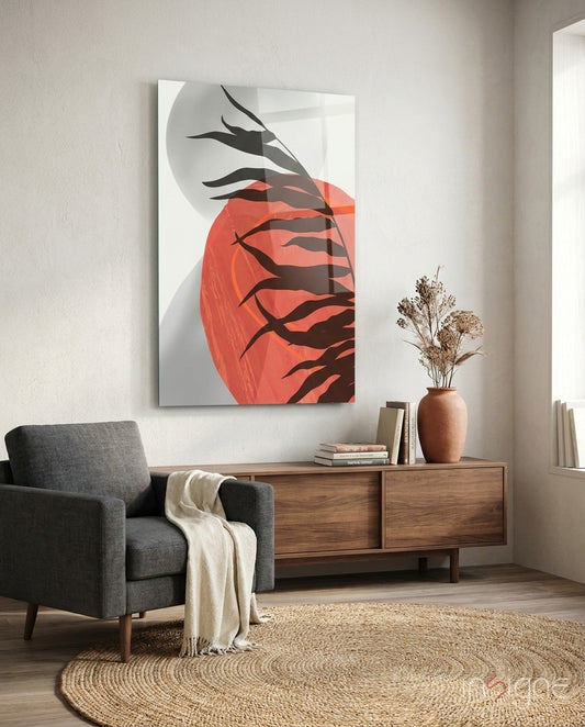 Modern living room with red and black glass wall art depicting stylized branches against circular sun, displayed above wooden dresser.