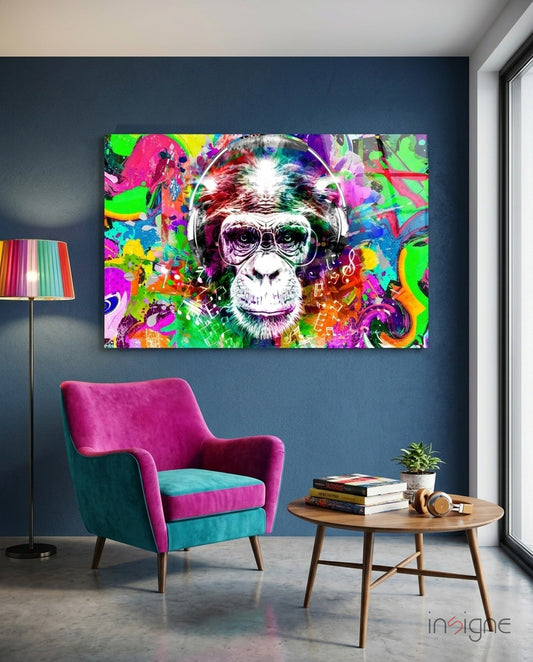 Colorful glass wall art depicting a psychedelic monkey wearing headphones and glasses, displayed in a modern living room setting.