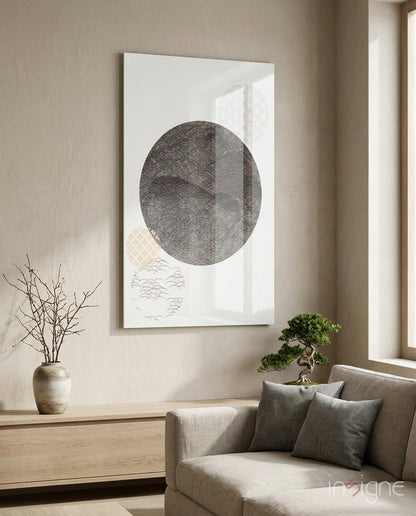 Black Moon Glass Wall Art displayed above a beige armchair in a minimalist room with dried branches and bonsai plant.