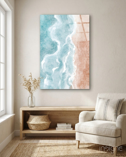 Aerial beach wall art displaying turquoise waves and sandy shore, hung above wooden console table in coastal-themed living room.