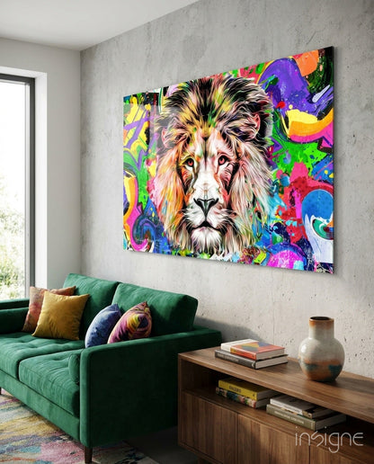 Vibrant multicolored lion head glass wall art displayed above a green sofa in a modern living room setting.