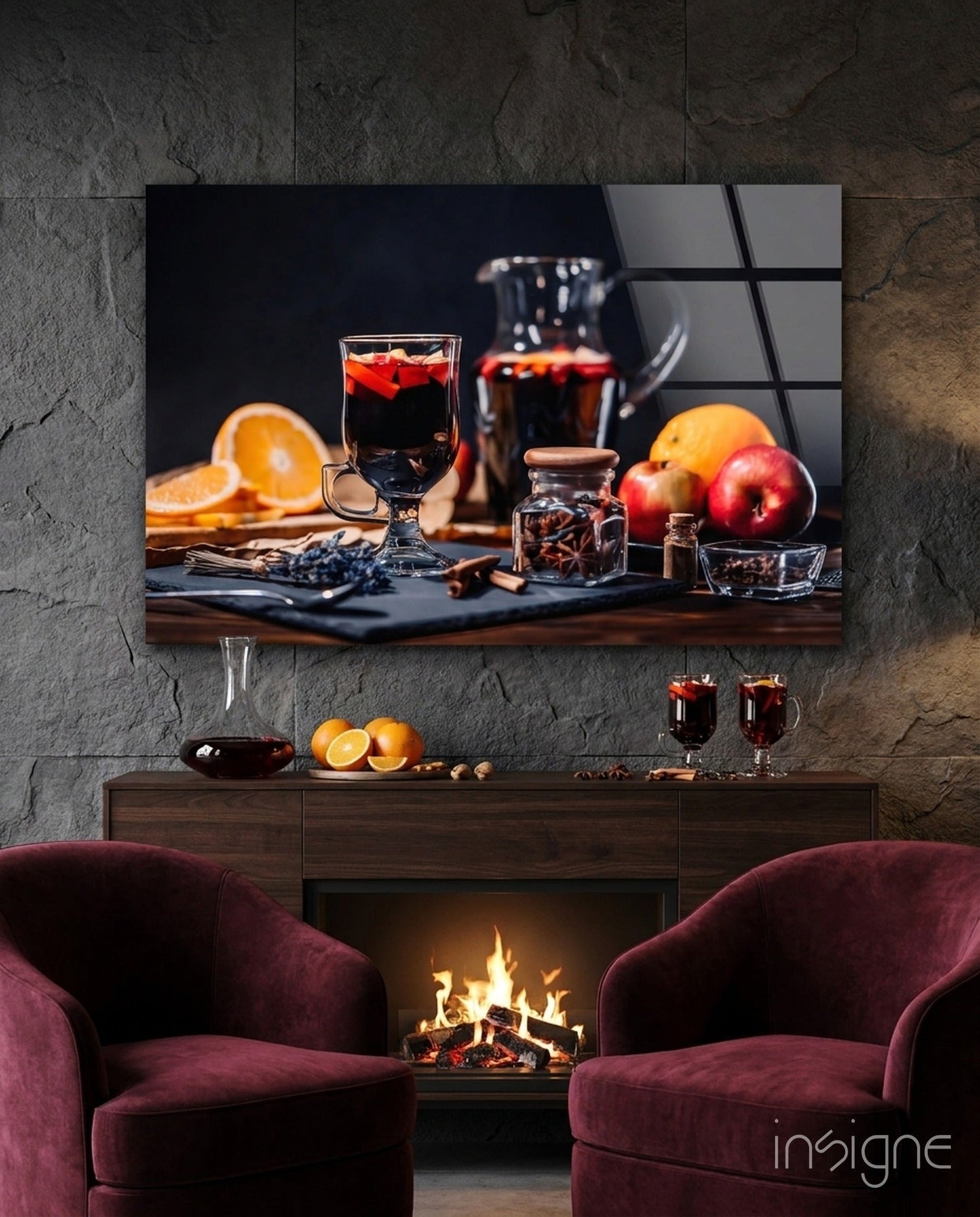 Noel Tea Glass Wall Art displayed above a fireplace mantel between two burgundy chairs, showing festive beverages and citrus fruits.