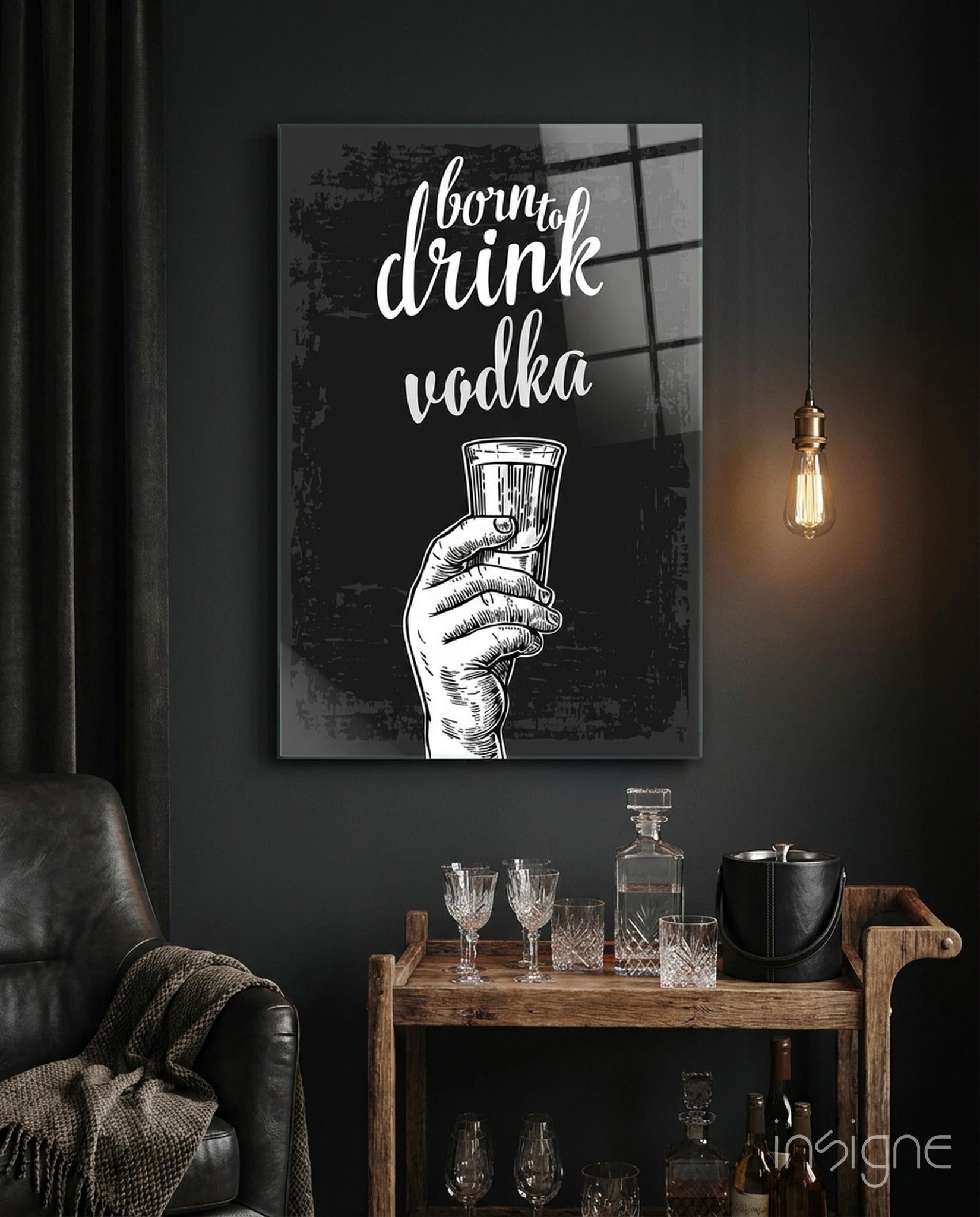 Black and white canvas featuring "born to drink vodka" text with illustrated hand holding glass, displayed above wooden bar cart with glassware.