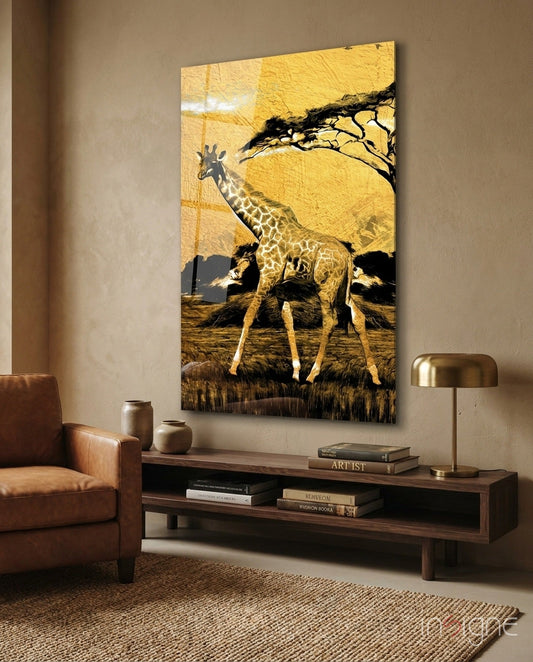 Gold acacia tree giraffe glass wall art displayed above wooden console table in modern living room with leather chair.