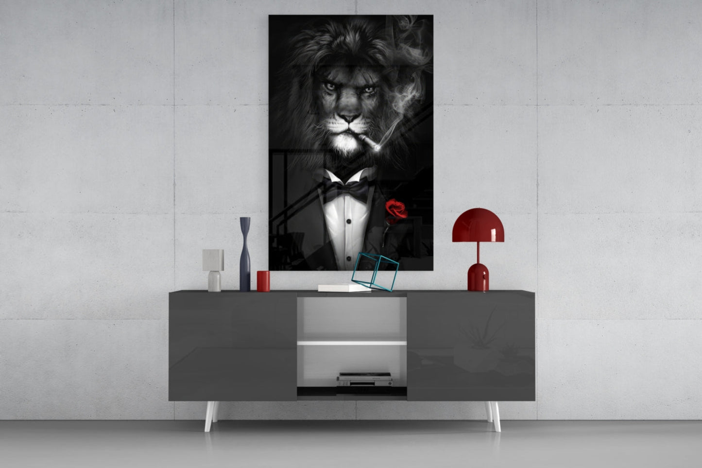 Black and white glass wall art of a lion wearing a tuxedo with bow tie and red rose, displayed above a gray console table in a modern interior setting.
