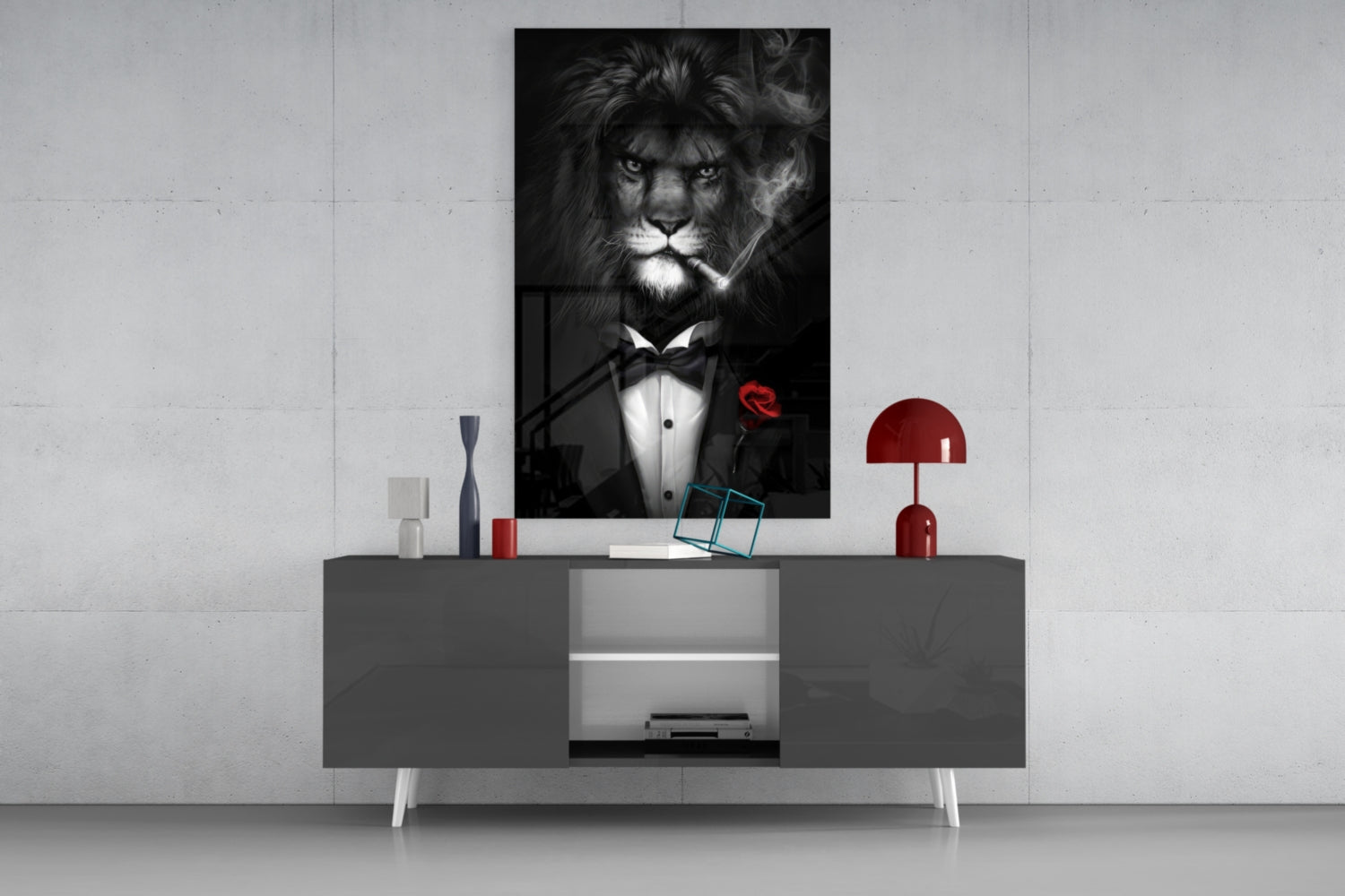 Black and white glass wall art of a lion wearing a tuxedo with bow tie and red rose, displayed above a gray console table in a modern interior setting.