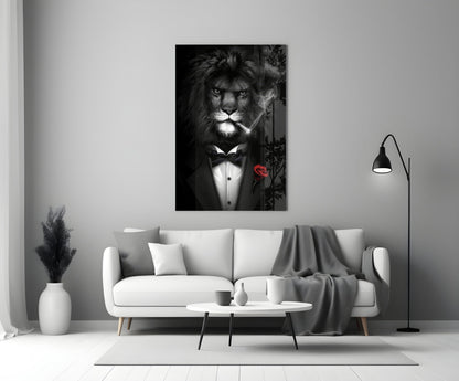 Black and white glass wall art of a lion wearing a tuxedo and bow tie with a red rose, displayed above a white sofa in a modern living room.