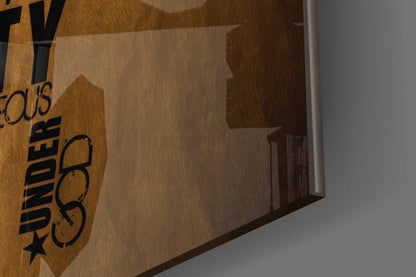 Angled view of wooden USA map wall art with "WANDER" text and star logo on left edge, showing wood grain texture and glass surface.